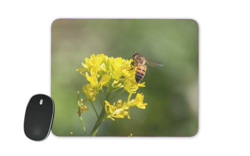  A bee in the yellow mustard flowers voor Mousepad